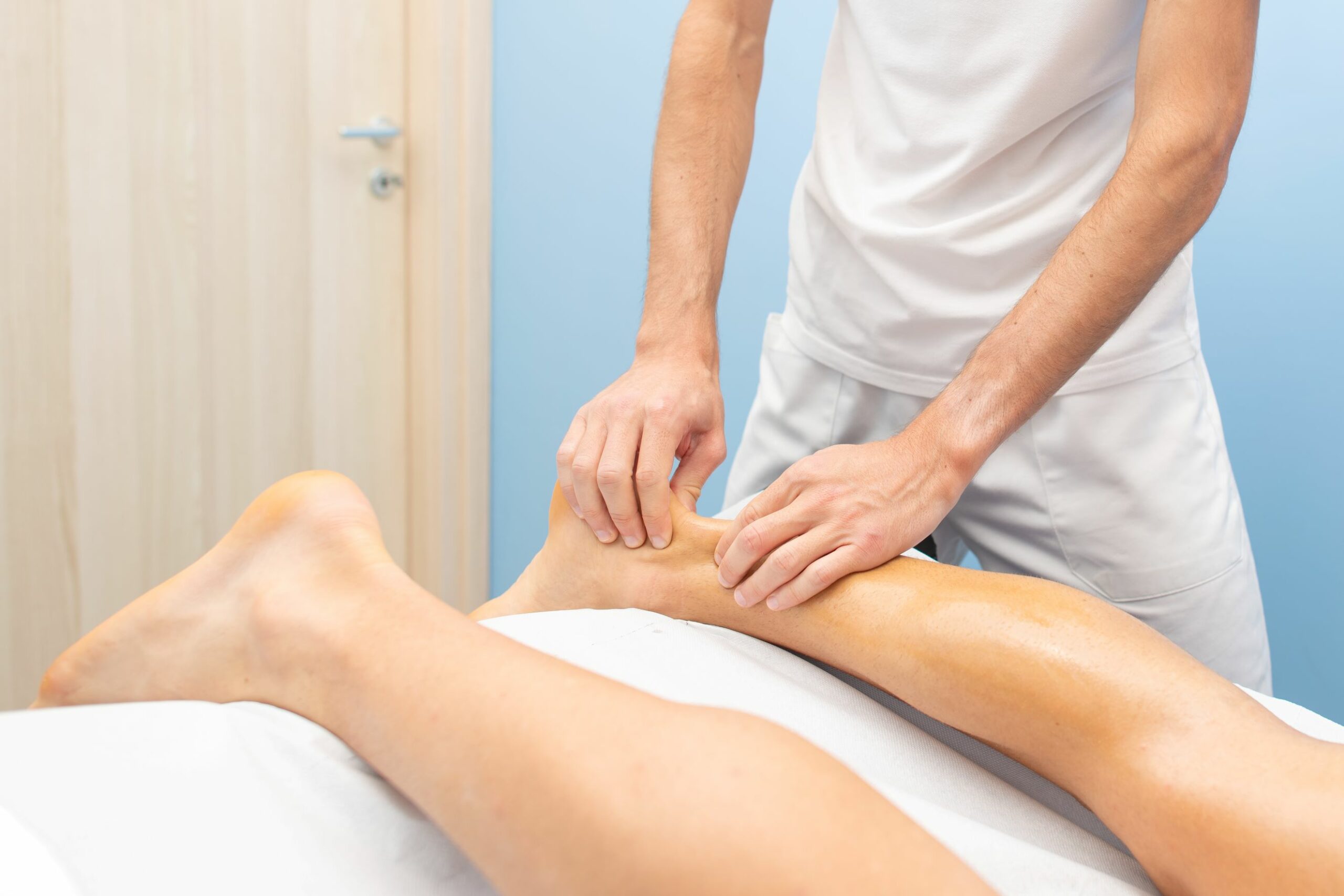 physiotherapist-during-an-achilles-tendon-treatmen